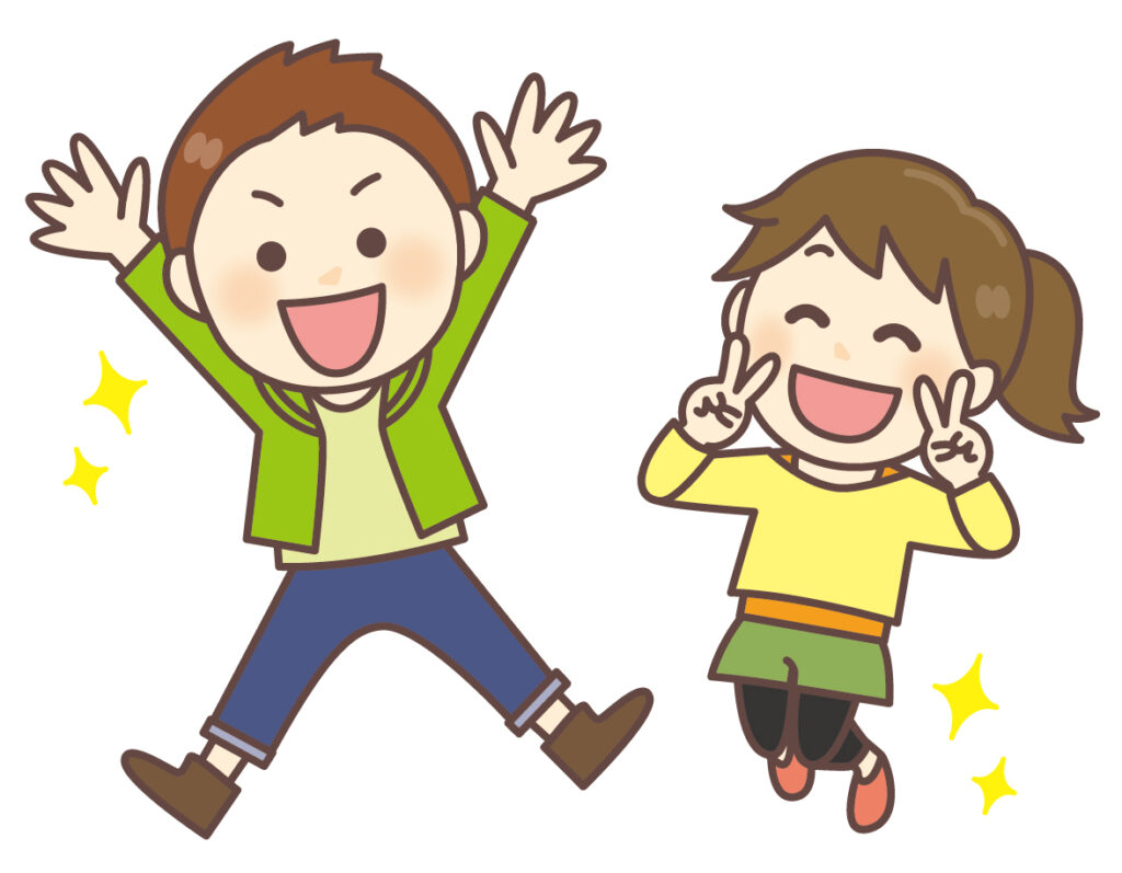 ジャンプする小学生の男女