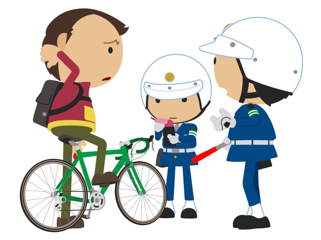 自転車違反で警察に止められる男性